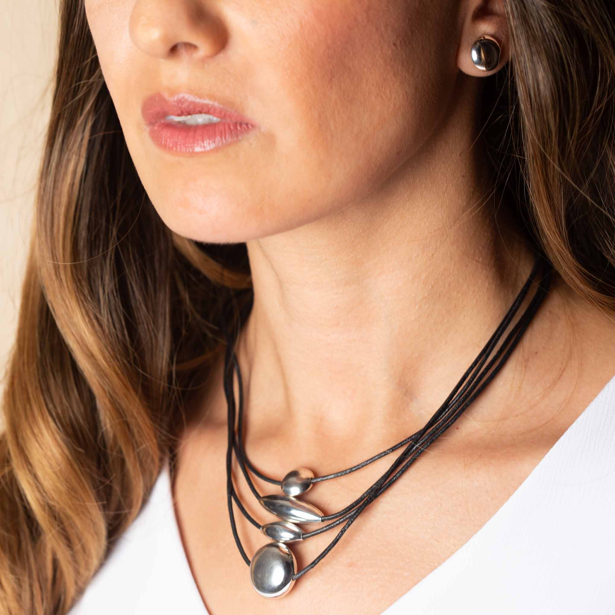 Leather necklace with geometric silver figures