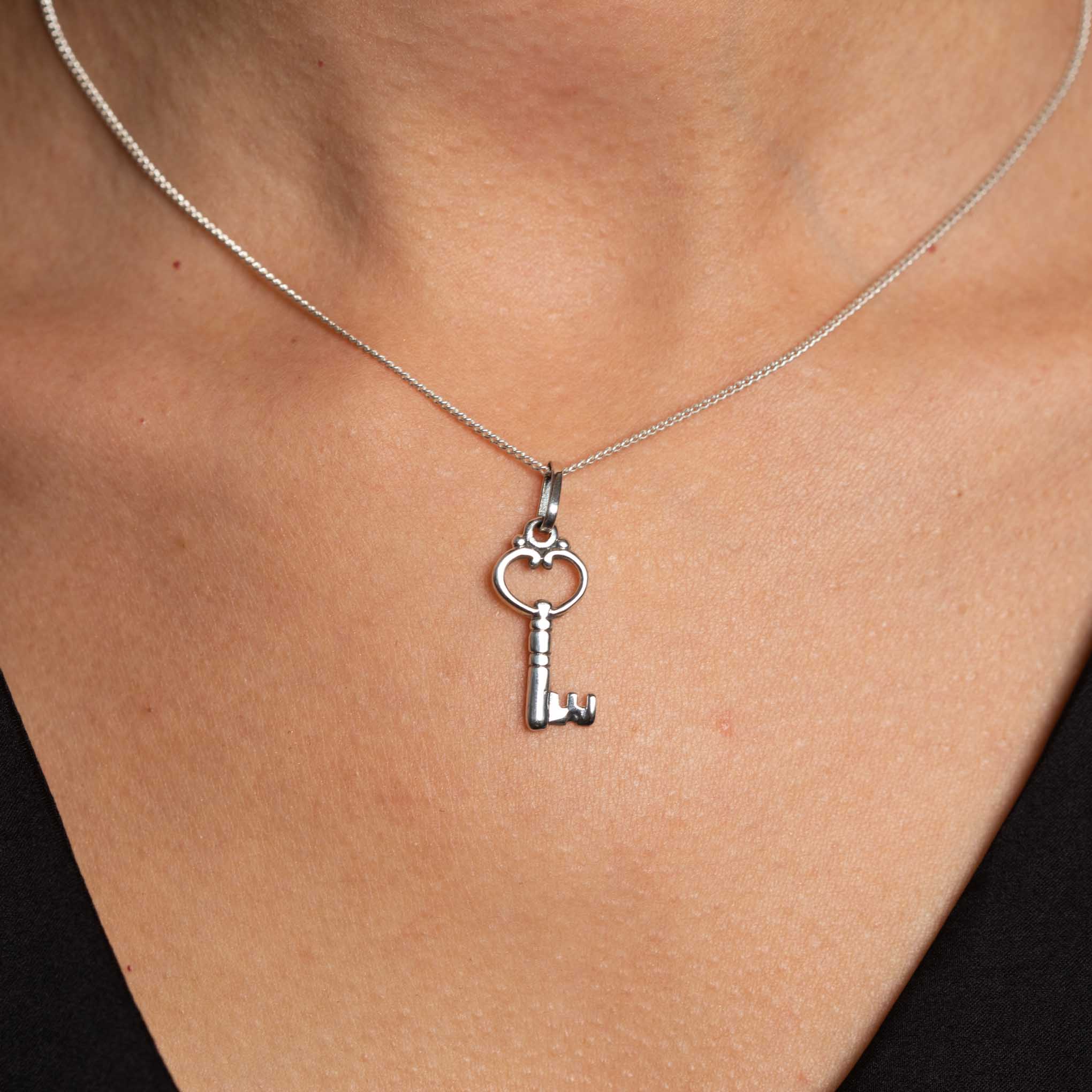 Silver pendant heart key
